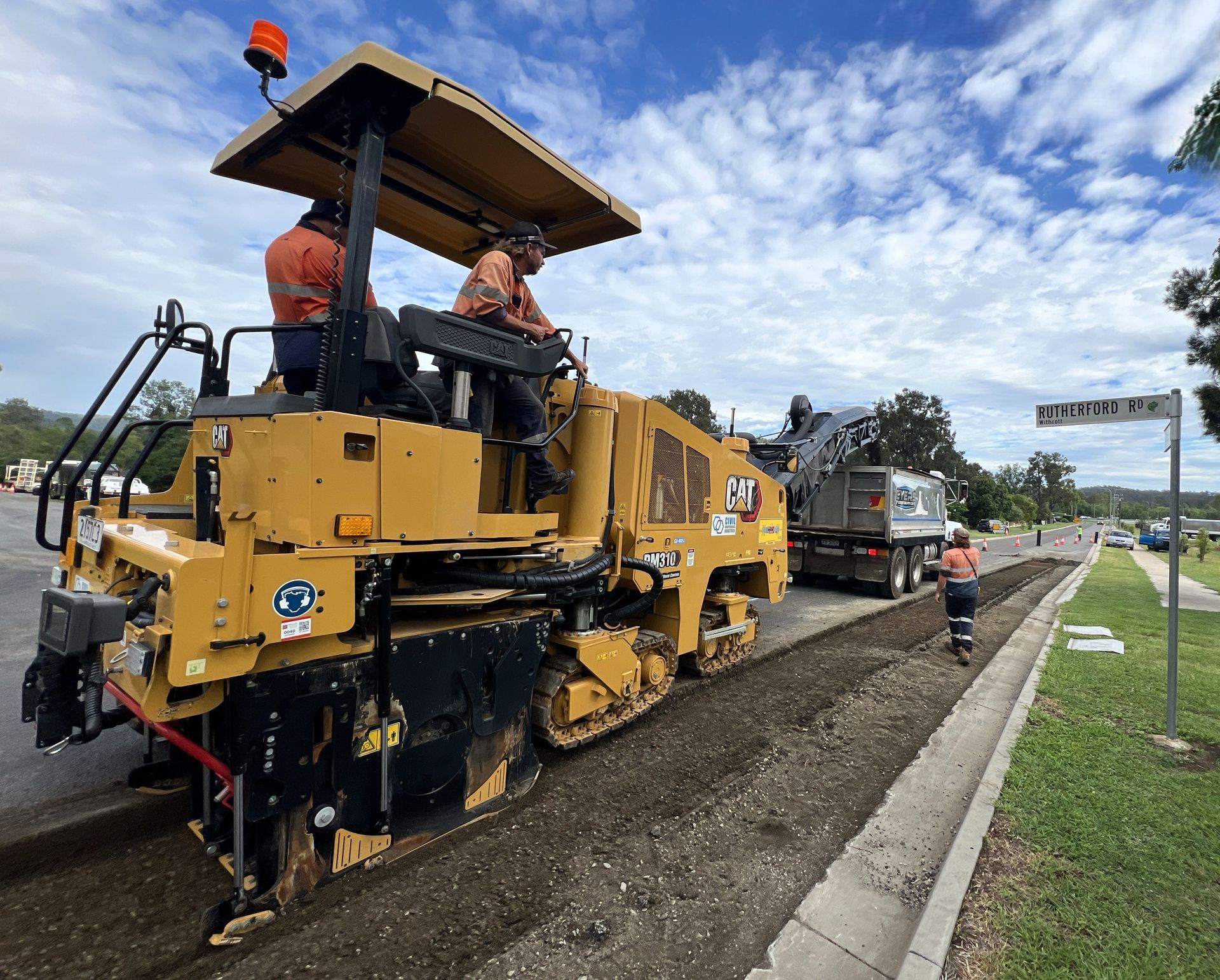 CII road profiler removing existing asphalt pavement ahead of resurfacing