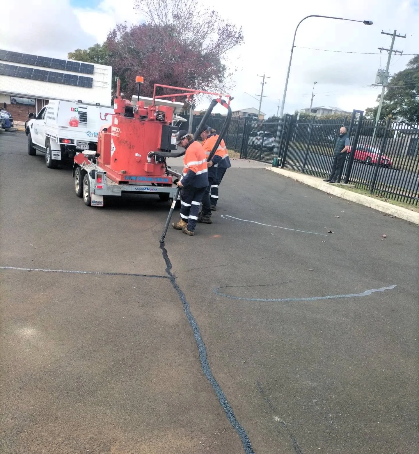 Civil Independence Industries crew crack sealing an asphalt car park surface